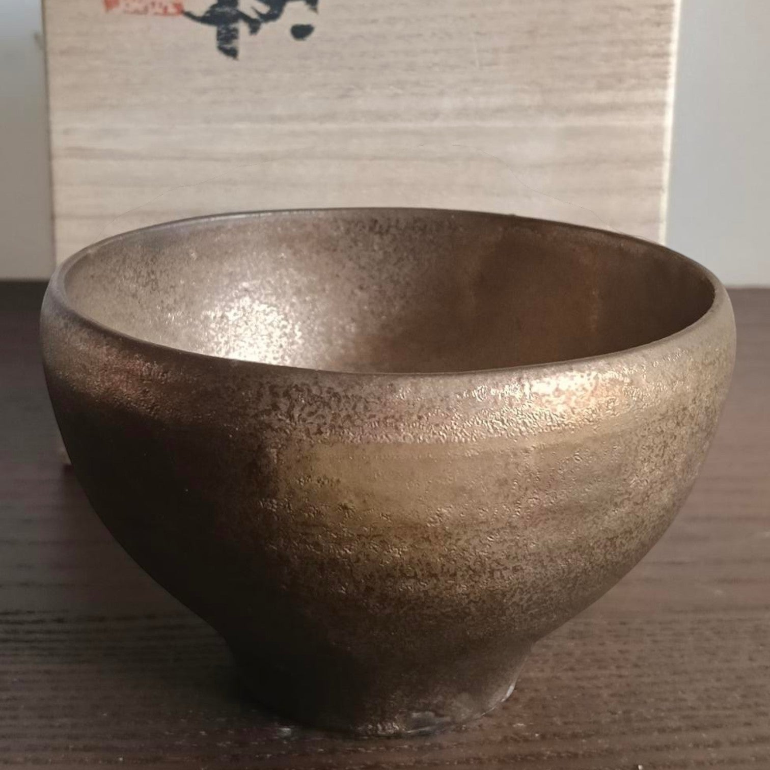 Polo Express "Earth Gold" Chawan tea bowl with a metallic gold and copper glaze, presented with its wooden box.